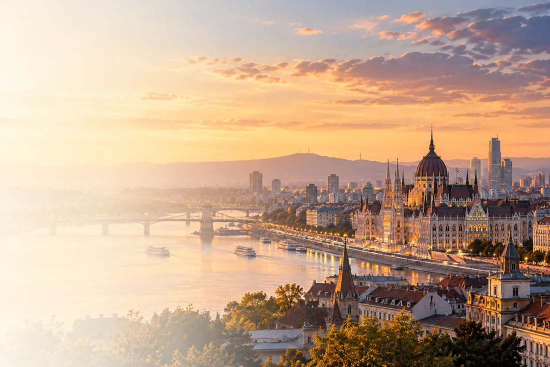 An editorial composite of European architecture and the Korean skyline at sunset